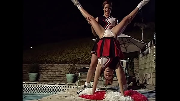 Two cheerleaders enjoy in swim pool with each other’s tits and pussies